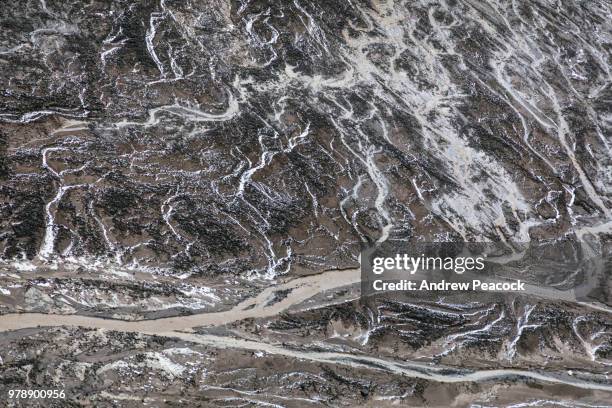 abstract patterns formed by snow melt water run off in a crater at telefon bay, deception island, south shetland islands - am telefon stockfoto's en -beelden