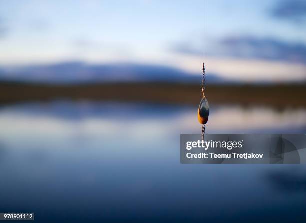 Fishing Lure By Lake Outdoors High-Res Stock Photo - Getty Images