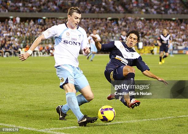 Sebastian Ryall of Sydney and Marvin Angulo of Melbourne contest possession during the A-League Grand Final match between the Melbourne Victory and...