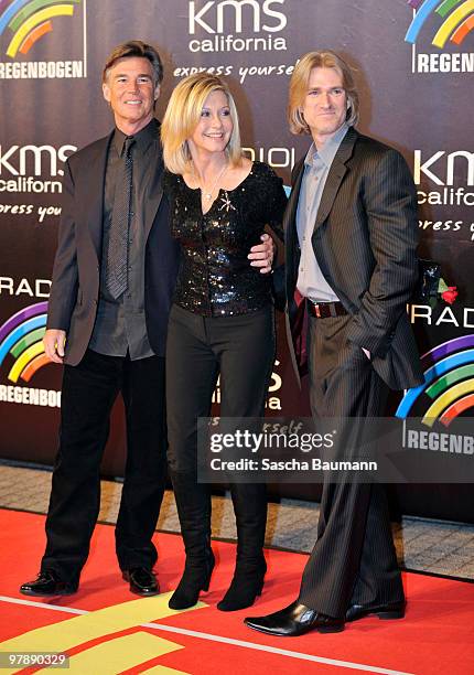 John Easterling, Olivia Newton John and guest arrive for the Radio Regenbogen Award at the Schwarzwaldhalle on March 19, 2010 in Karlsruhe, Germany.