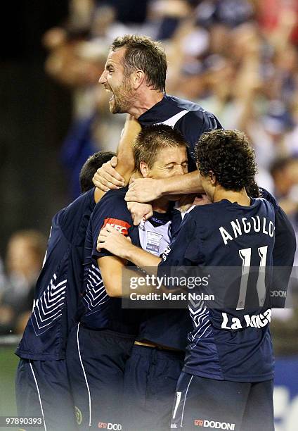 Grant Gruber of Melbourne celebrates with team mate Adrian Leijer after Leijer scored during the A-League Grand Final match between the Melbourne...