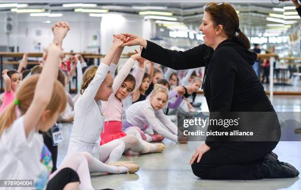 February 2018, Germany, Berlin: Christina Tarelkin, director of the young ensemble of the Friedrichstadt-Palast, corrects children during the casting...