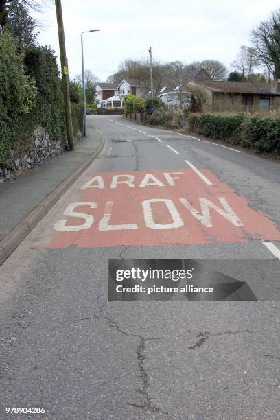 February 2018, Great Britain, Llanfairpwllgwyngyllgogerychwyrndrobwllllantysiliogogogoch: A two-language road sign. Welsh and English are the offial...