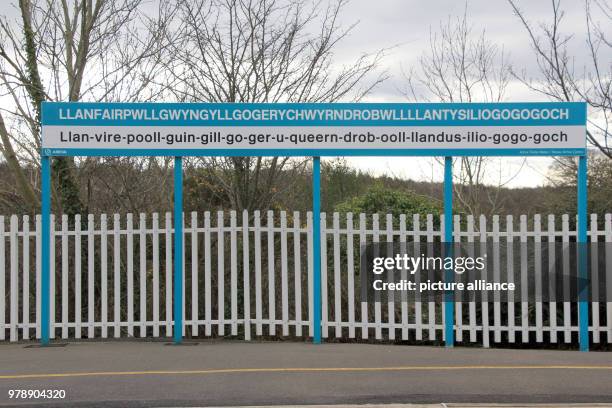 February 2018, Great Britain, Llanfairpwllgwyngyllgogerychwyrndrobwllllantysiliogogogoch: The main station's city sign. It belongs to the most...
