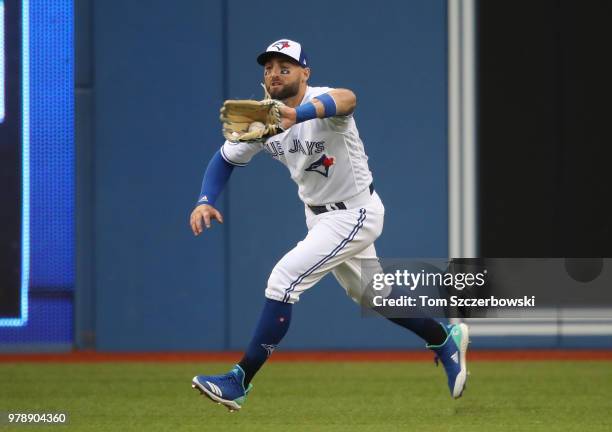 Kevin Pillar of the Toronto Blue Jays makes a running catch in the third inning during MLB game action against the Atlanta Braves at Rogers Centre on...