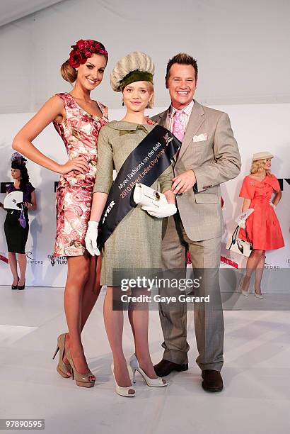 Laura Dundovic with Fashions on the Field winner Stephanie Meneve and Richard Reid pose at Myer Ladies Day as part of the Golden Slipper Racing...