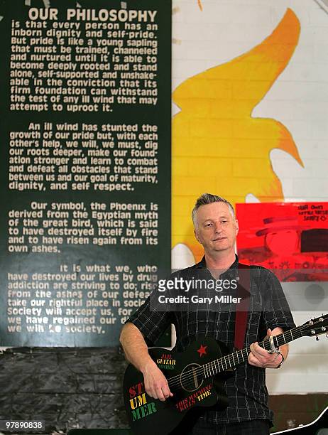 Musician Billy Bragg speaks to students at the Phoenix Academy Of Austin as part of the "Jail Guitar Doors" program during the South By Southwest...