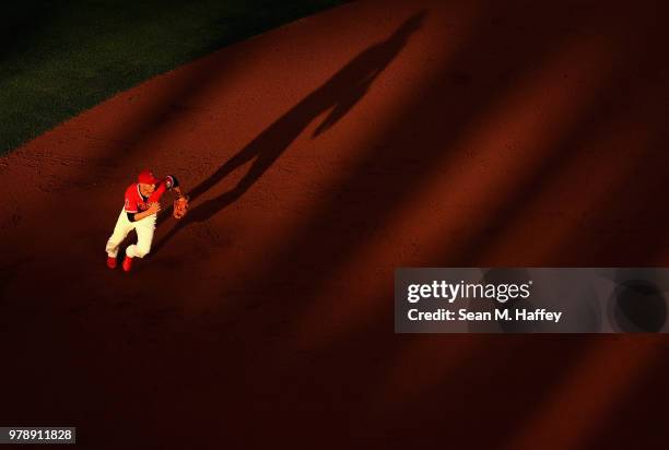 Andrelton Simmons of the Los Angeles Angels of Anaheim runs to field a grounder hit by David Peralta of the Arizona Diamondbacks during the inning of...