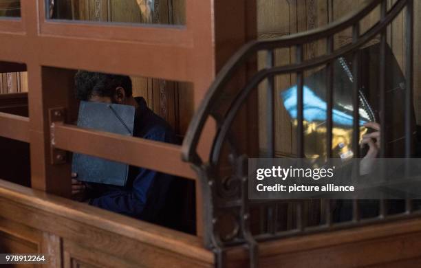 Ibrahim Al Sheich A. And Alali A., two suspected members of the Islamic State terrorist militia and of the Al-Nusra Front, sitting in a courtroom in...