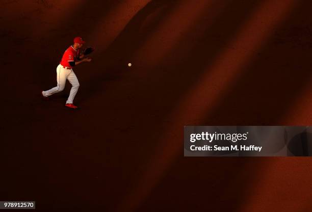 Andrelton Simmons of the Los Angeles Angels of Anaheim fields a grounder hit by David Peralta of the Arizona Diamondbacks during the inning of a game...