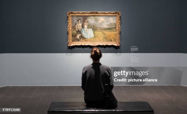 March 2018, Germany, Hamburg: A woman looks at the work "Mr. Und Mrs. Andrews" by Thomas Gainsborough at the exhibition "Thomas Gainsborough - the...