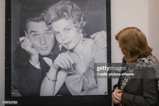 Dpatop - 28 Febuary 2018, Germany, Hanover: The widow Gundula Fuchsberger looks at a photo of herself with her deceased husband Joachim Fuchsberger....