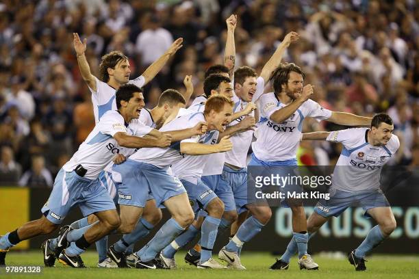 Sydney FC players celebrate after winning the penalty shoot-out for victory during the A-League Grand Final match between the Melbourne Victory and...
