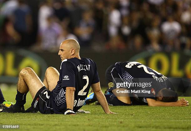 Kevin Muscat and Rodrigo Vargas of the Victory look dejected after losing the penalty shoot-out during the A-League Grand Final match between the...