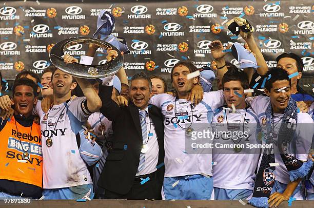 Sydney FC players celebrate with the trophy after winning the A-League Grand Final match between the Melbourne Victory and Sydney FC at Etihad...