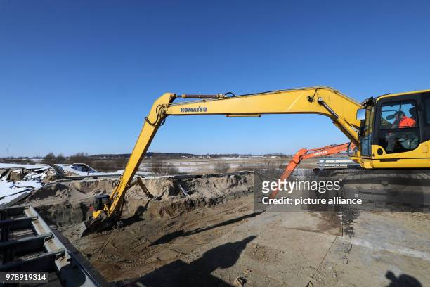 Excavators removing earth from the sunken Baltic Sea autobahn A20 near Tribsees, Germany, 01 March 2018. Federal Transportation Minister Schmidt has...