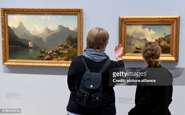 March 2018, Germany, Alkersum: Visitors standing in the exhibition "Fascination Norway". The Museum of West Coast Art on Foehr island has chosen...
