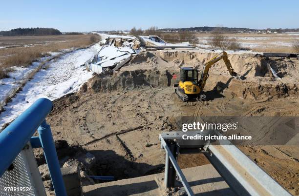 An excavator removing earth from the sunken Baltic Sea autobahn A20 near Tribsees, Germany, 01 March 2018. Federal Transportation Minister Schmidt...