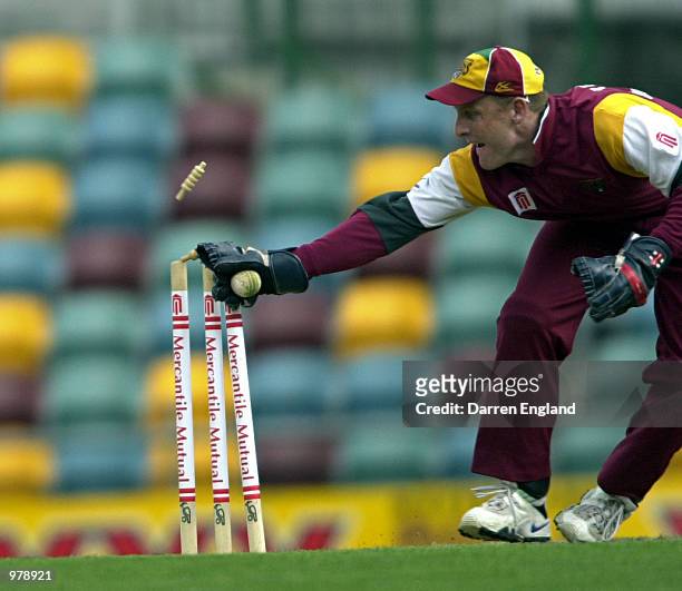 Wade Seccombe of Queensland stumps Simon Dart of Victoria for 38 runs during the Mercantile Mutual Cup cricket match between Queensland and Victoria...