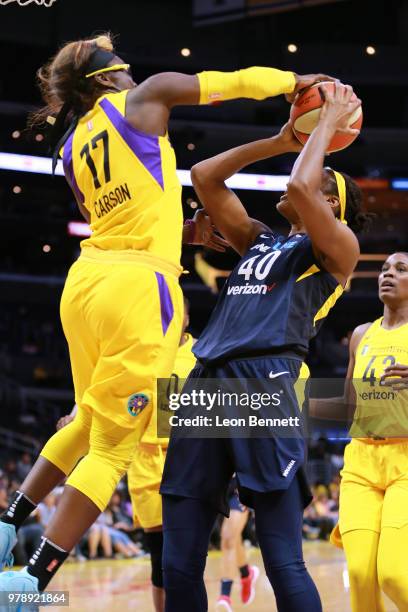 Essence Carson of the Los Angeles Sparks blocks the shot of Kayla Alexander of the Indiana Fever during a WNBA basketball game at Staples Center on...