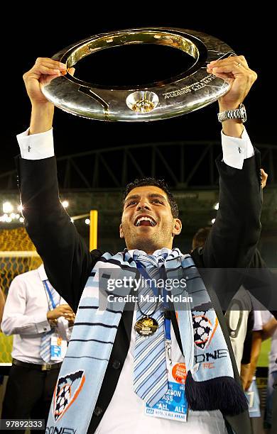 John Aloisi of Sydney holds the trophy after the A-League Grand Final match between the Melbourne Victory and Sydney FC at Etihad Stadium on March...