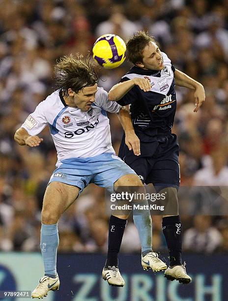 Evan Berger of the Victory and Karol Kisel of Sydney compete for a header during the A-League Grand Final match between the Melbourne Victory and...