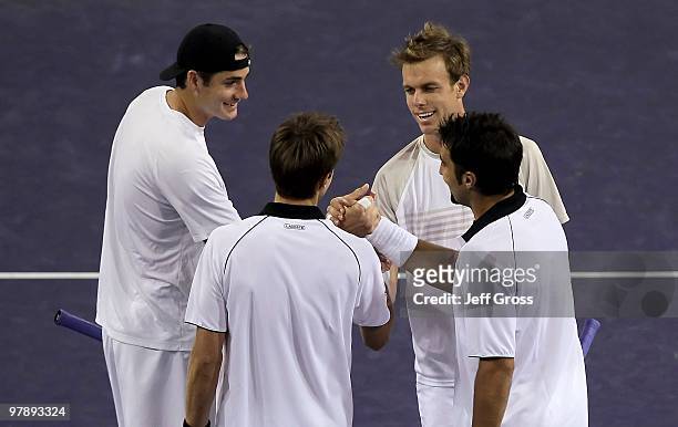John Isner of the USA, Daniel Nestor of Canada , Sam Querrey of the USA and Nenad Zimonjic of Serbia congratulate each other following the men's...