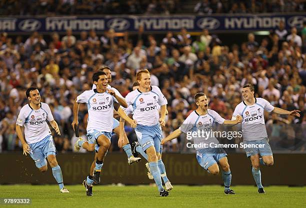 Sydney FC players celebrate winning the penalty shootout in extra time during the A-League Grand Final match between the Melbourne Victory and Sydney...