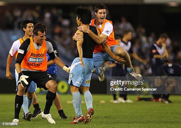 Sung-Hwan Byun of Sydney FC celebrates with team mate Christophetr Payne after winning the A-League Grand Final match between the Melbourne Victory...