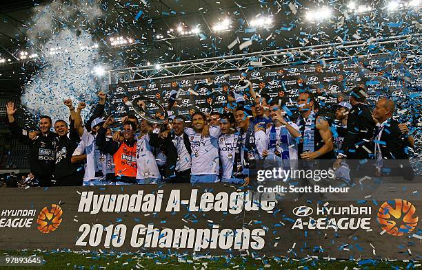 Sydney FC players celebrate with the trophy after winning the A-League Grand Final match between the Melbourne Victory and Sydney FC at Etihad...