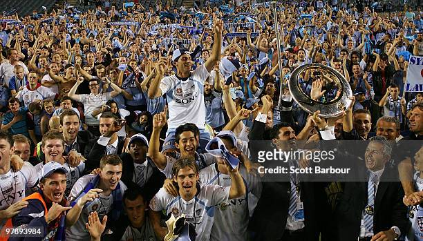 Sydney FC players pose for a team shot with Sydney fans after winning the A-League Grand Final match between the Melbourne Victory and Sydney FC at...