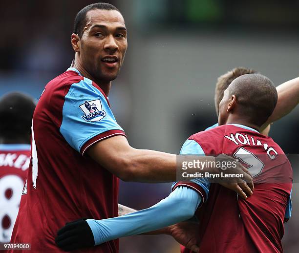John Carew of Aston Villa celebrates scroring with team mate Ashley Young during the Barclays Premier League match between Aston Villa and...