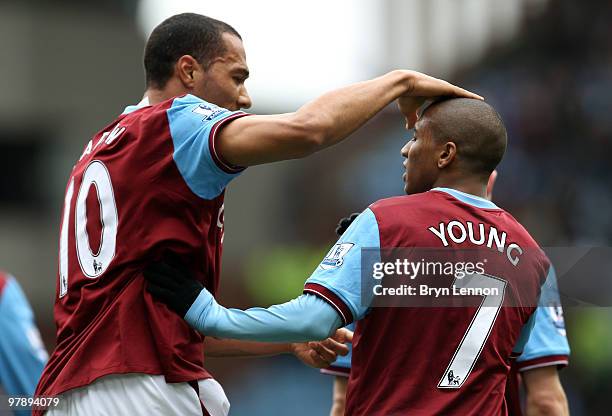 John Carew of Aston Villa celebrates scroring with team mate Ashley Young during the Barclays Premier League match between Aston Villa and...