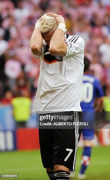 German midfielder Bastian Schweinsteiger looks dejected after Croatia defeated Germany in the Euro 2008 Championships Group B football match on June...