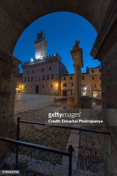 night view at montepulciano,tuscany,italy. - asciano stock-fotos und bilder
