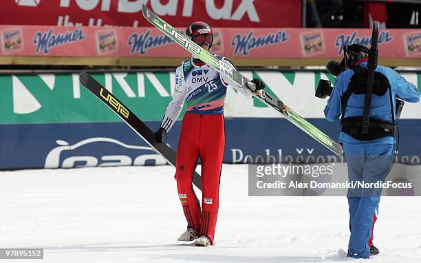 Robert Kranjec of Slovenia reacts after the final jump during the individual event of the Ski jumping World Championships on March 20, 2010 in...