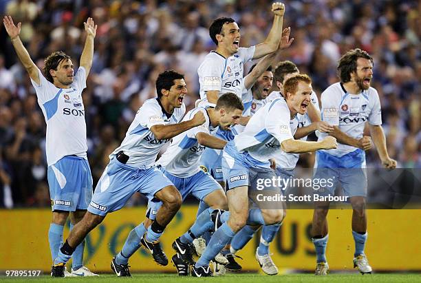 Sydney FC players celebrate after winning the penalty shoot-out for victory during the A-League Grand Final match between the Melbourne Victory and...