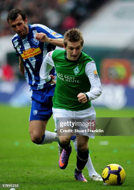 Marko Marin of Bremen is challenged by Christoph Dabrowski of Bochum during the Bundesliga match between SV Werder Bremen and VfL Bochum at Weser...