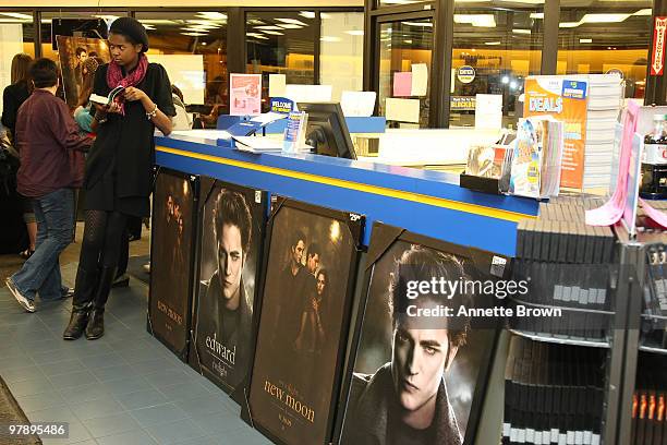 Kalin Wilson reads a book while waiting for the New Moon cast members to arive the "The Twilight Saga: New Moon" DVD release at Blockbuster...