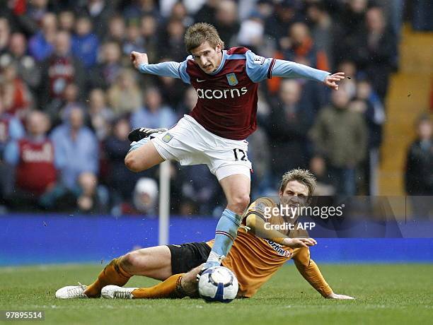 Aston Villa's English midfielder Marc Albrighton vies with Wolverhampton Wanderers' Irish striker Kevin Doyle during the English Premier League...