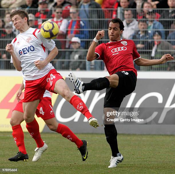 Benjamin Baier of Kickers Offenbach and Malte Metzelder of FC Ingolstadt battle for the ball during the 3.Liga match between FC Ingolstadt and...