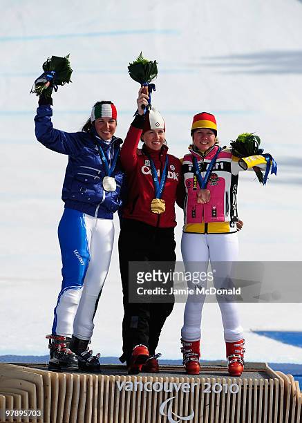 Bronze medalist Andrea Rothfuss of Germany, gold medalist Lauren Woolstencroft of Canada and silver medalist Melania Corradini of Italy celebrate at...