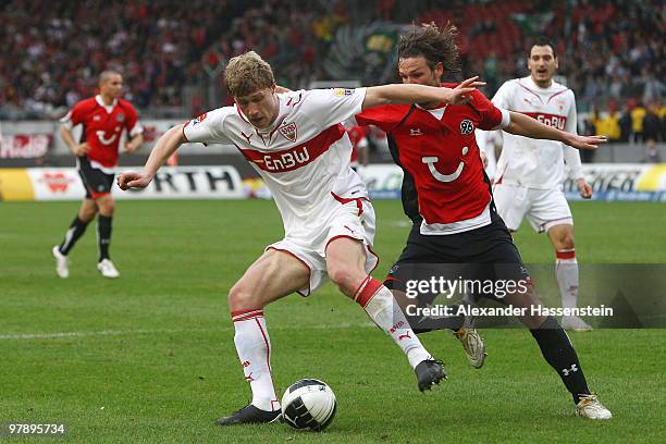 Pavel Pogrebnyak of Stuttgart battles for the ball with Christian Schulz of Hannover during the Bundesliga match between VfB Stuttgart and Hannover...