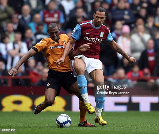 John Carew of Aston Villa is challenged by Ronald Zubar during the Barclays Premier League match between Aston Villa and Wolverhampton Wanderers at...