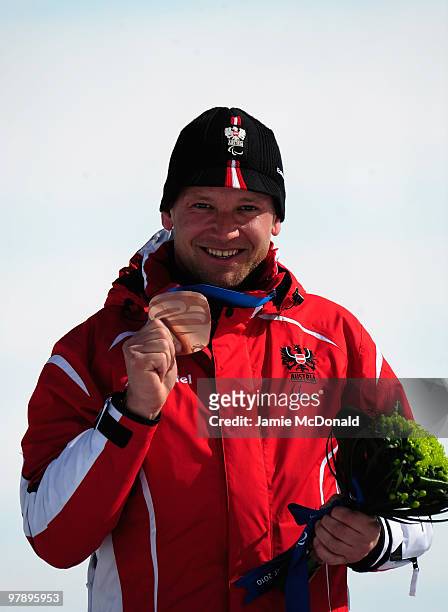 Bronze medalist Hubert Mandl of Austria celebrates at the medal ceremony for the Men's Standing Super-G during Day 8 of the 2010 Vancouver Winter...