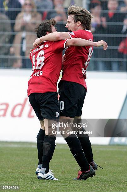 Fabian Gerber of FC Ingolstadt celebrates after scoring his team's first goal with team mate Andreas Buchner during the 3.Liga match between FC...
