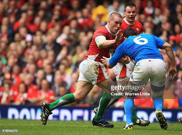 Matthew Rees of Wales hands off Paul Derbyshire of Italy during the RBS Six Nations Championship between Wales and Italy at Millennium Stadium on...