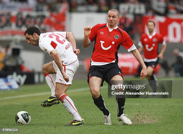 Cristian Molinaro of Stuttgart battles for the ball with Leon Andreasen of Hannover during the Bundesliga match between VfB Stuttgart and Hannover 96...