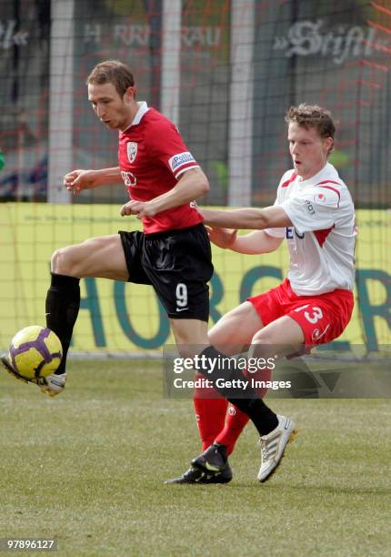 Moritz Hartmann of FC Ingolstadt and Marc Heitmeier of Kickers Offenbach battle for the ball during the 3.Liga match between FC Ingolstadt and...