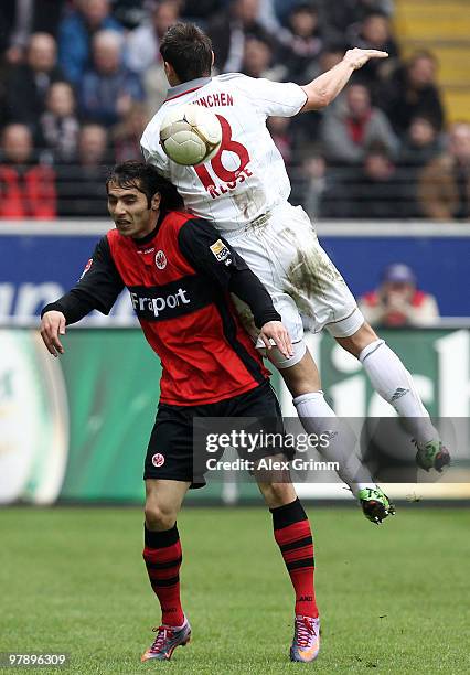 Halil Altintop of Frankfurt and Miroslav Klose of Muenchen jump for a header during the Bundesliga match between Eintracht Frankfurt and Bayern...